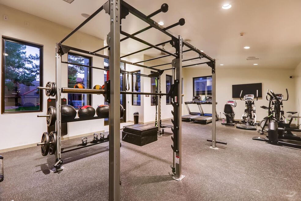 indoor gym area with multiple exercise equipment