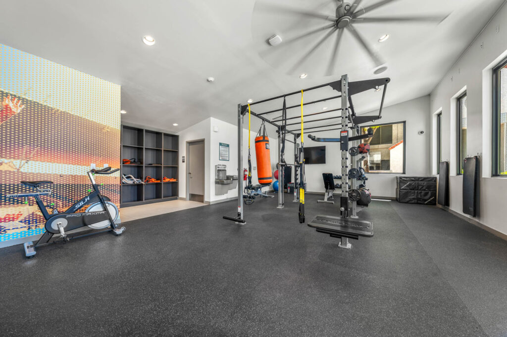 fitness center with punching bag and strength training equipment