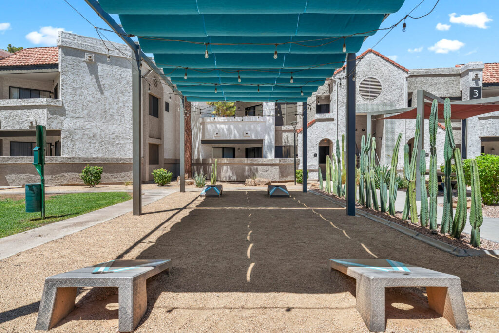 outdoor covered game lawn with cornhole