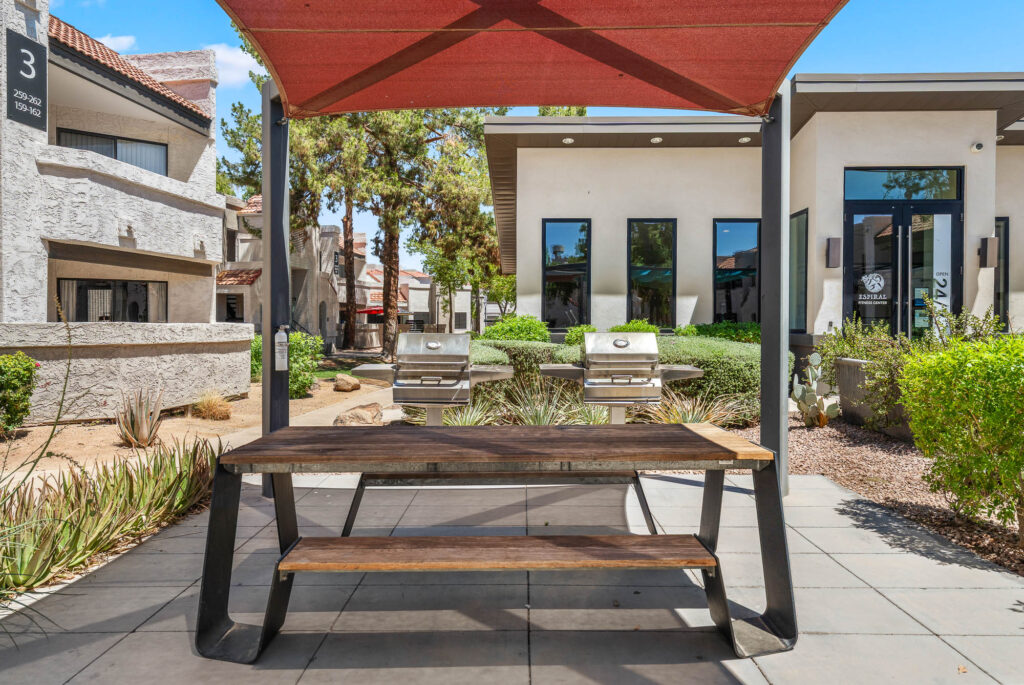 covered outdoor grilling station with picnic table