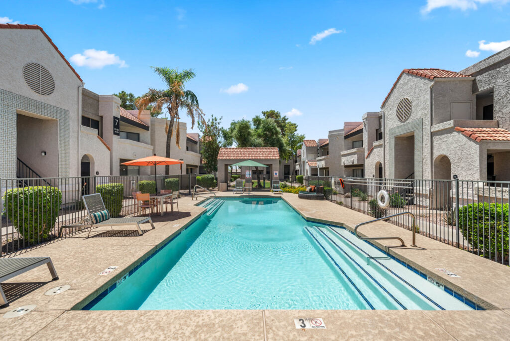 swimming pool with patio space and lounge seating